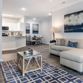 a living room with a couch, coffee table and tv