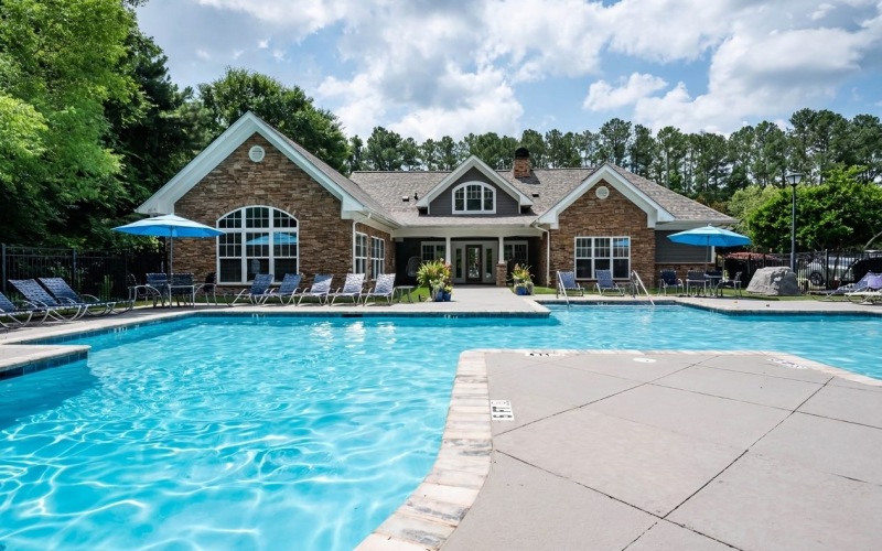 a swimming pool in front of a building