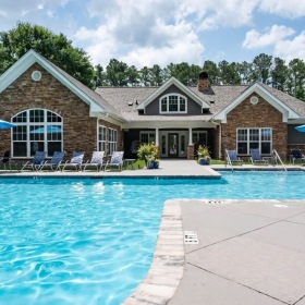 a swimming pool in front of a building